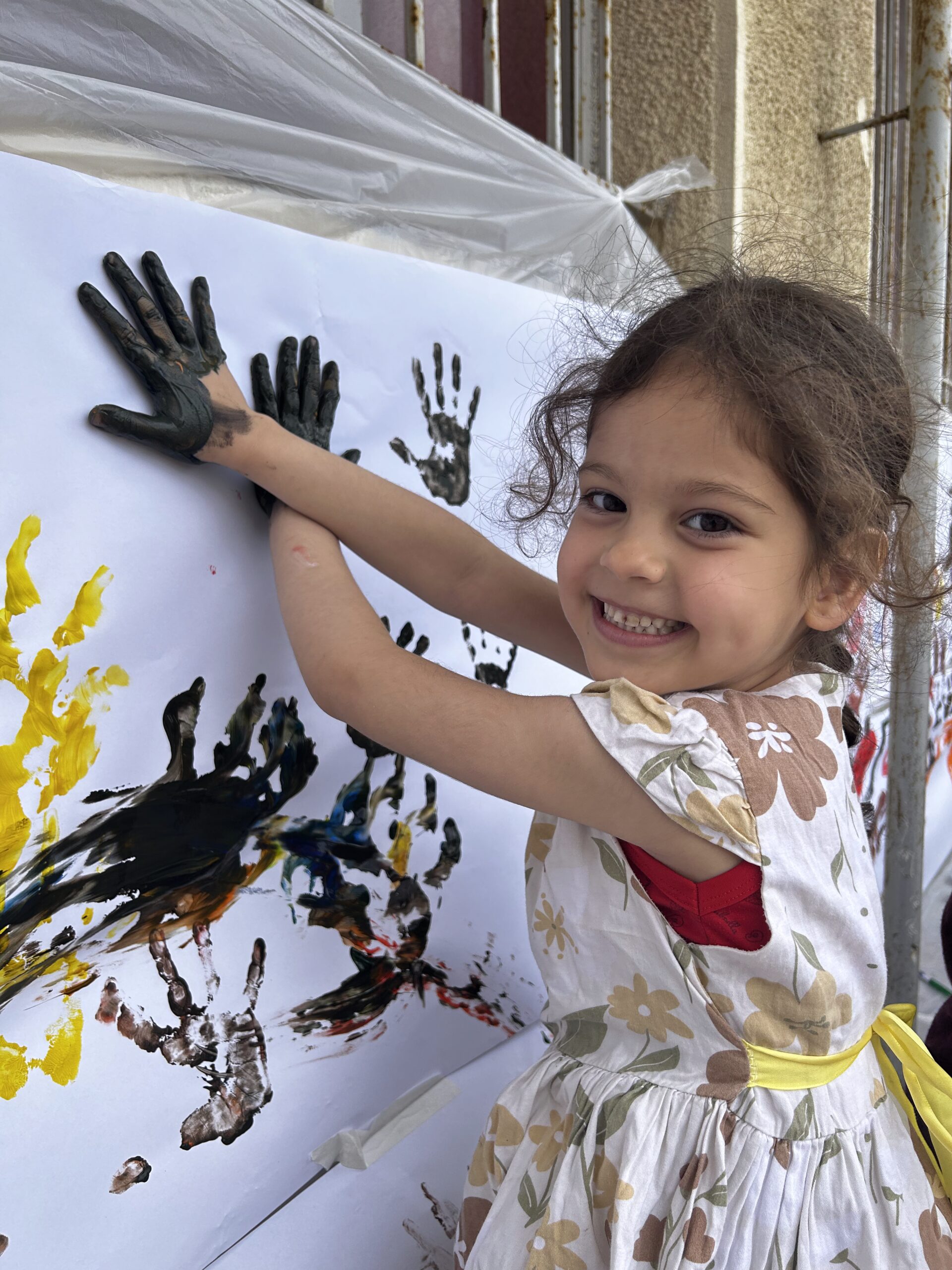 11_Girl_smiling_handprints